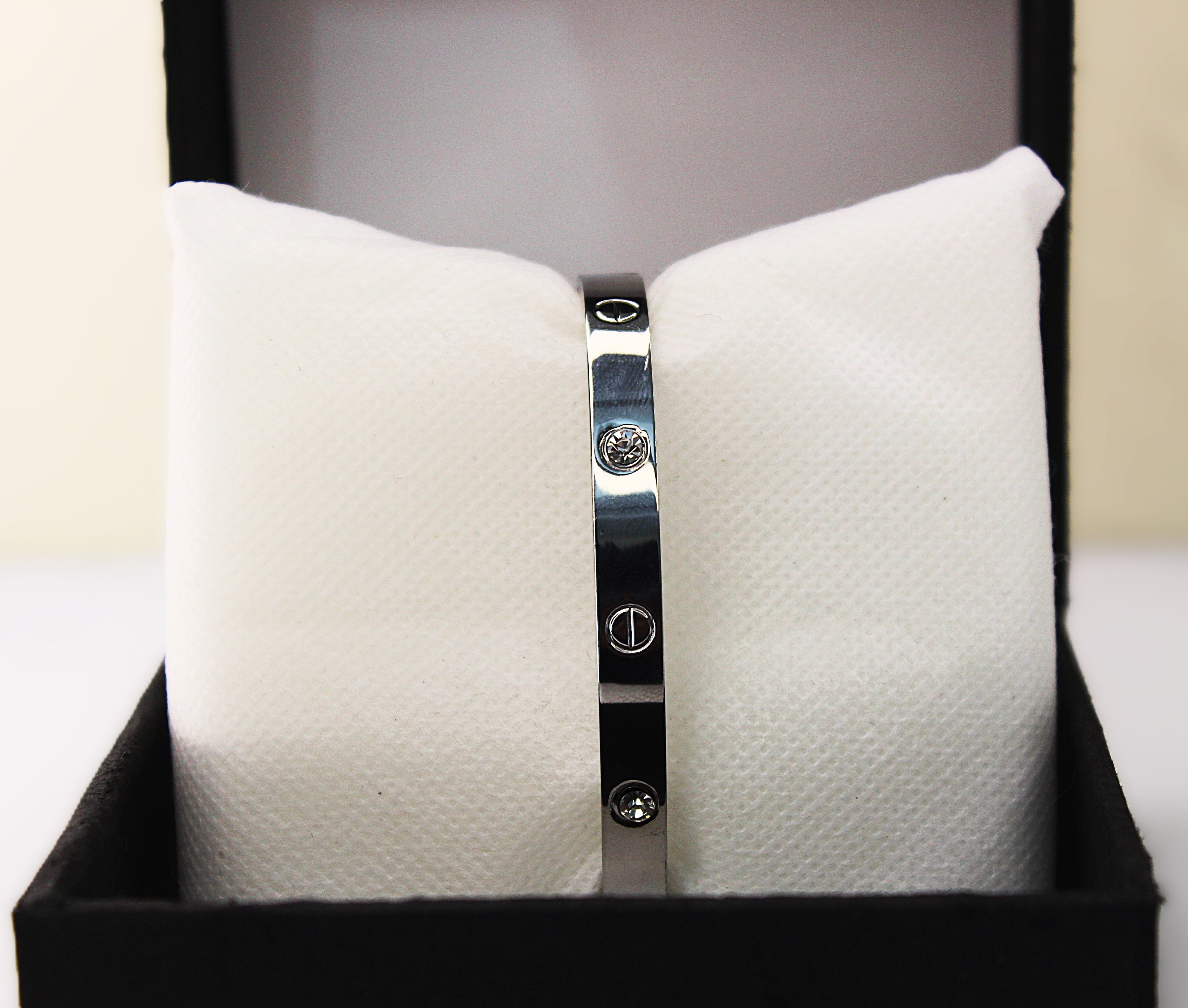 Sleek Silver Stainless Steel Braclet Adorned with Sparkling Crystals and Engraved Detailing