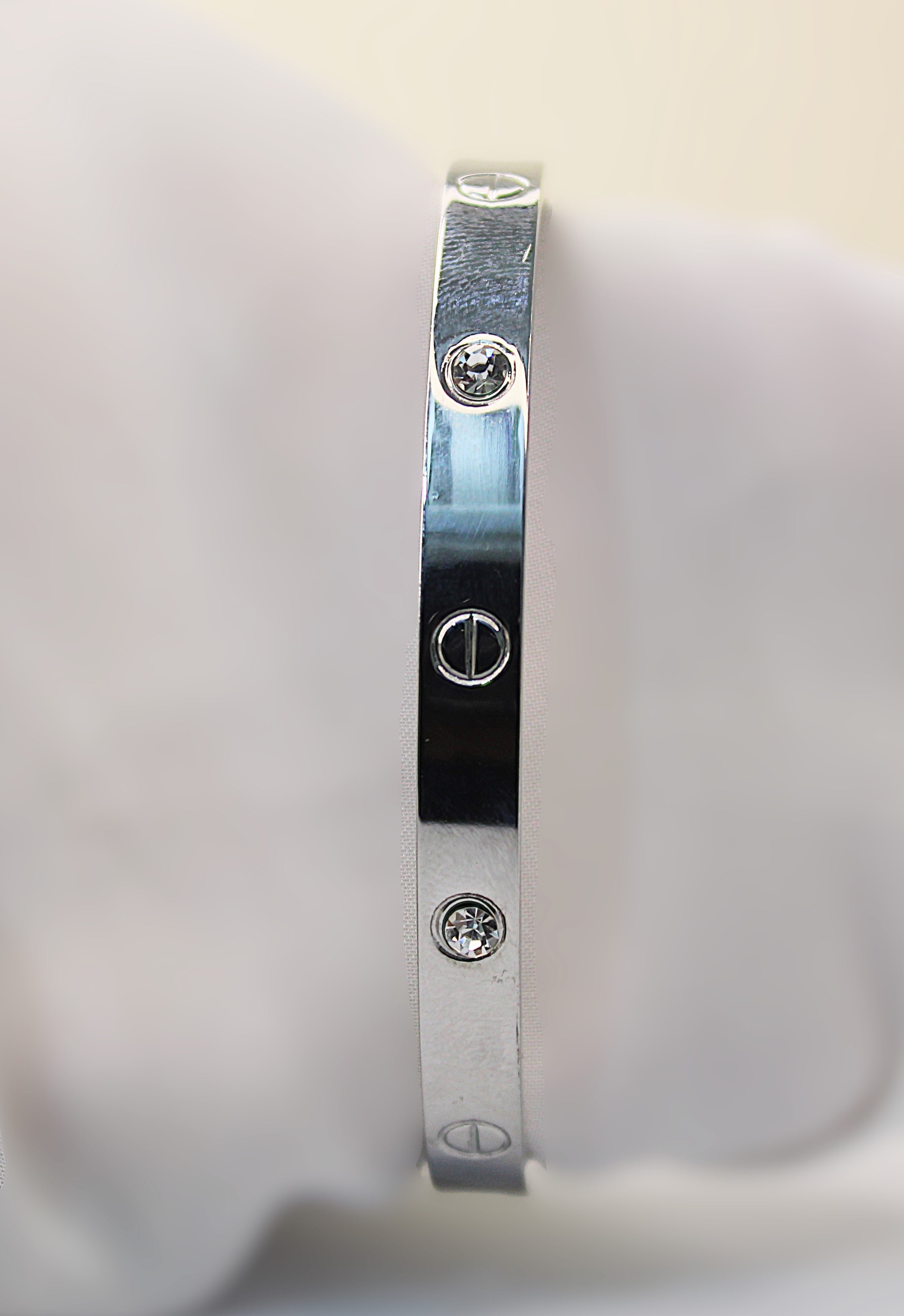 Sleek Silver Stainless Steel Braclet Adorned with Sparkling Crystals and Engraved Detailing