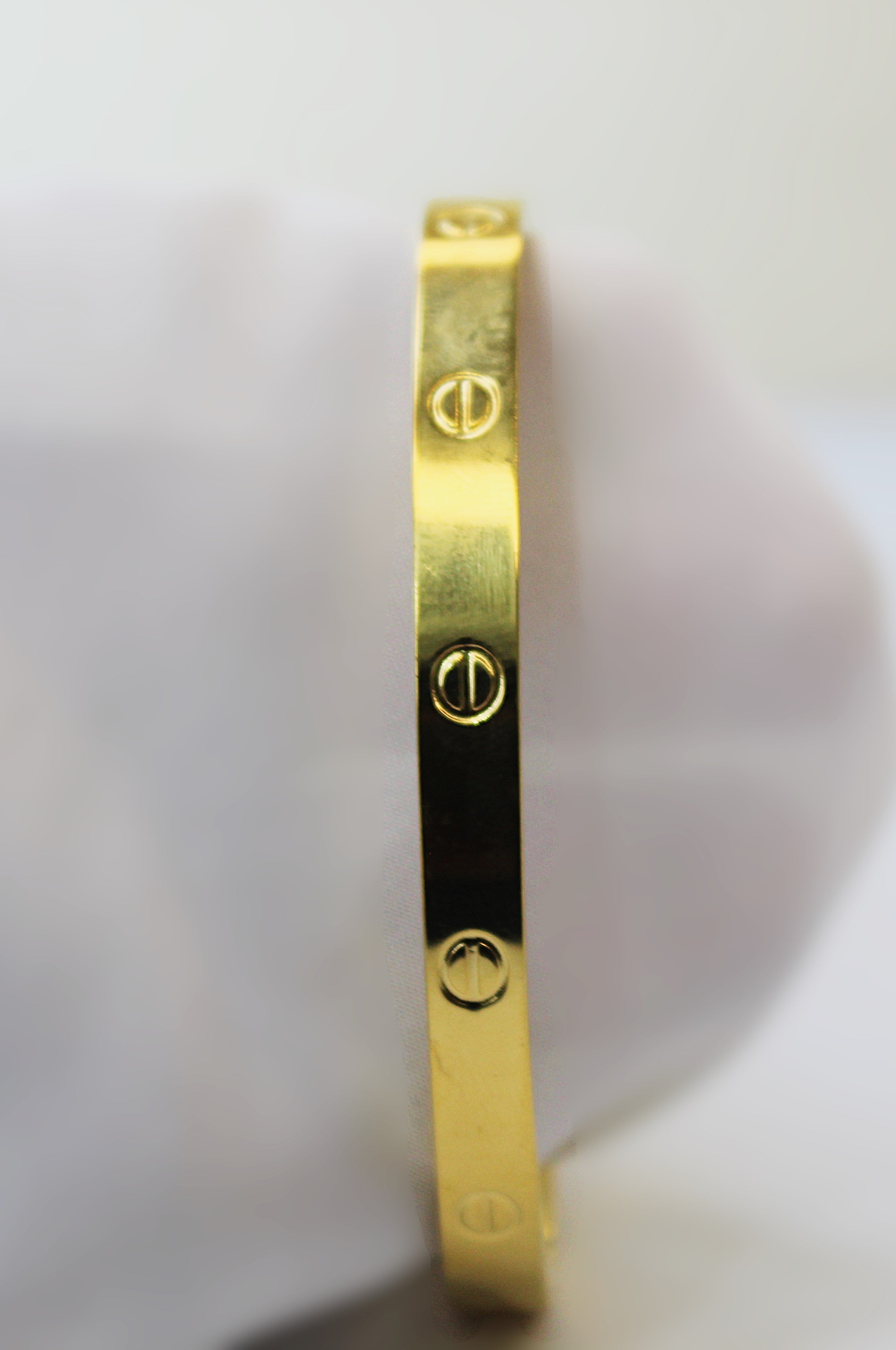 Stainless Steel Bangle with 1-Carat Gold Polish and Engraved Detailing