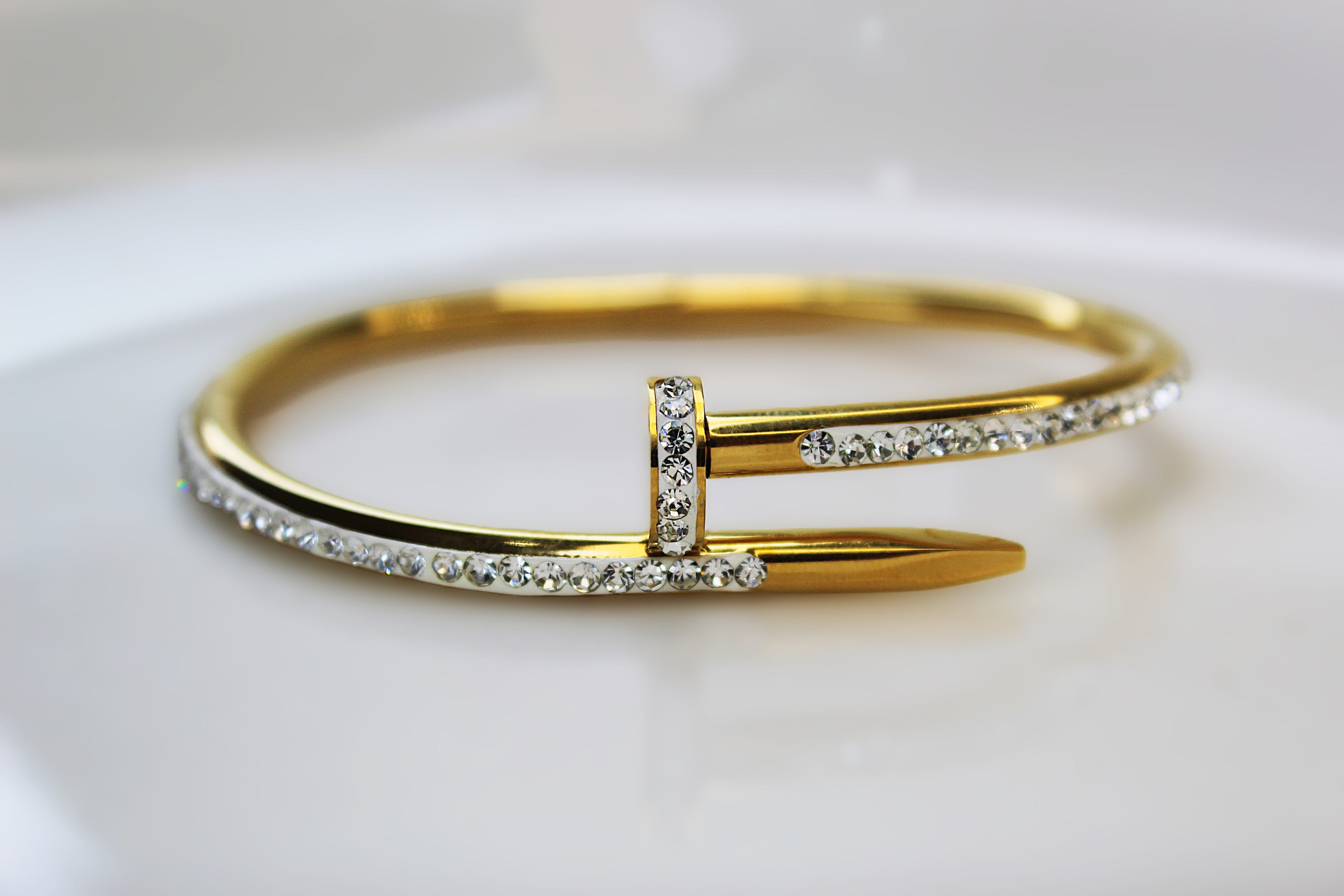 Luxury Golden Nail Bangle Stainless Steel Bracelet with 1 carat gold polish – Elegant Statement Jewelry