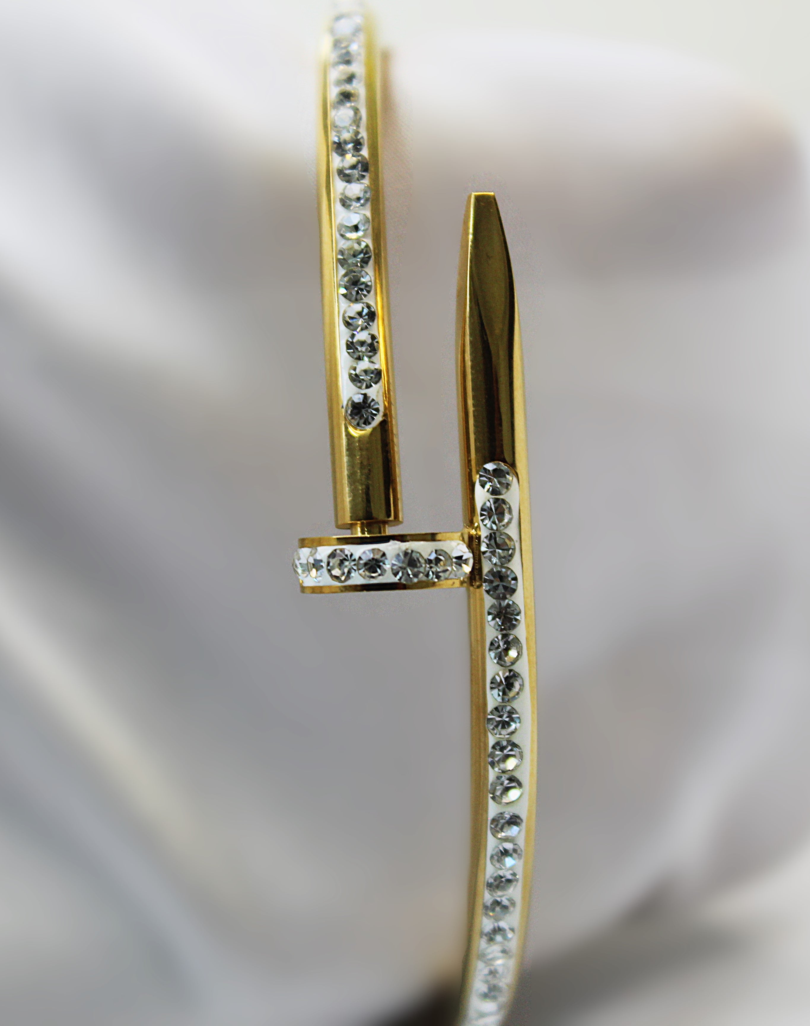 Luxury Golden Nail Bangle Stainless Steel Bracelet with 1 carat gold polish – Elegant Statement Jewelry