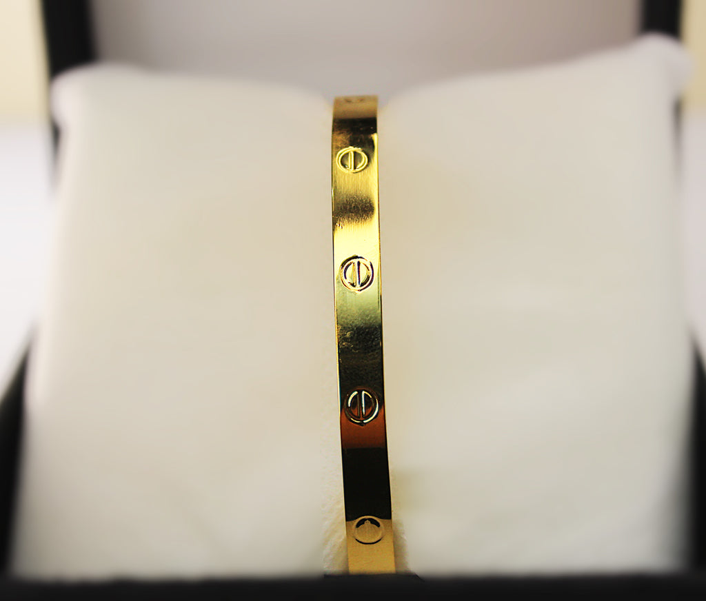 Stainless Steel Bangle with 1-Carat Gold Polish and Engraved Detailing